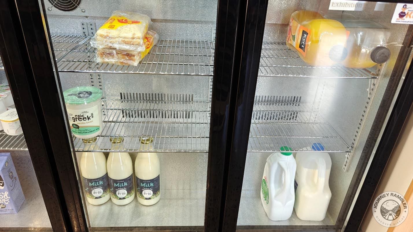 different containers of milk, Greek yogurt and juice