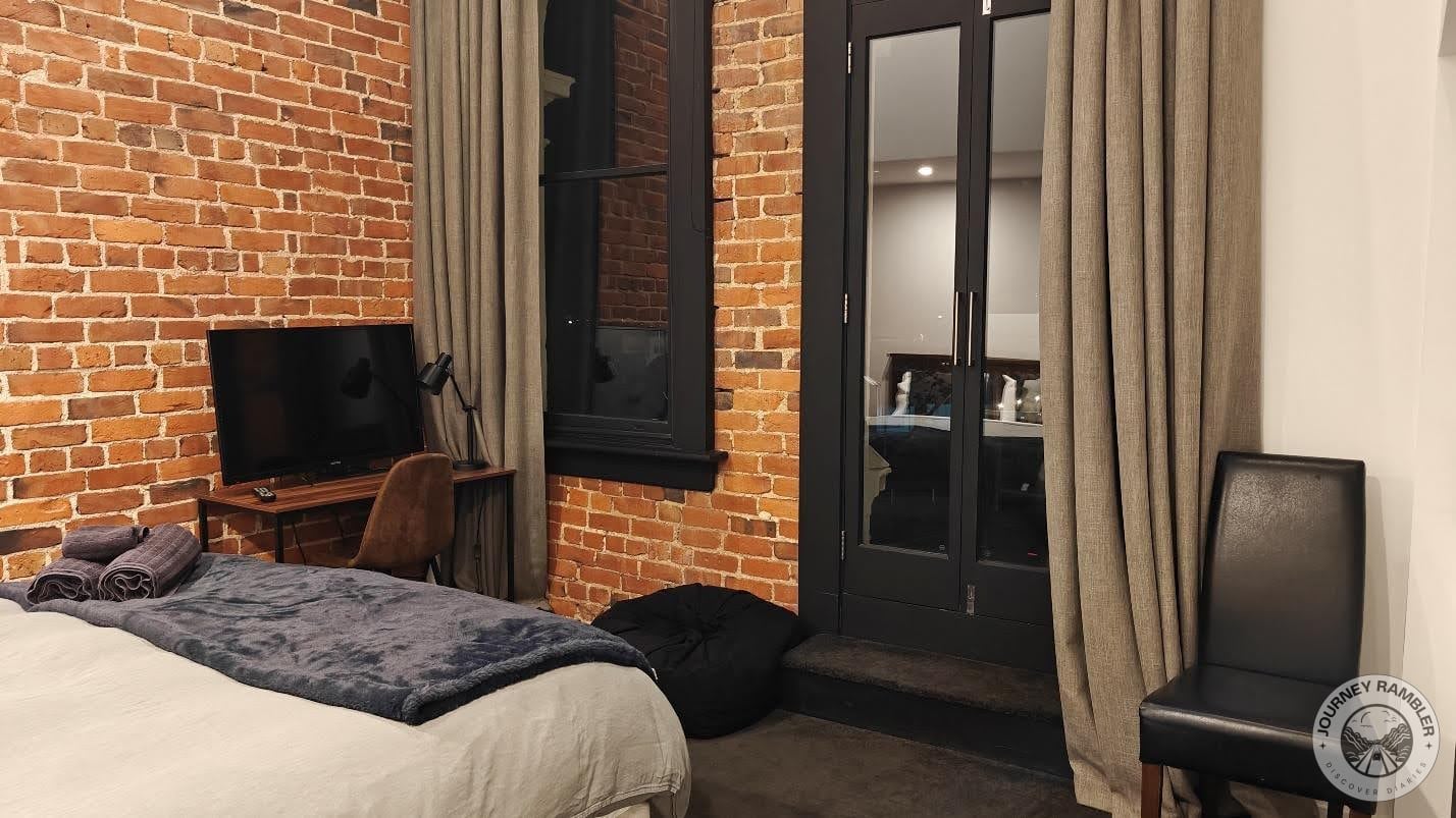 double bed and a desk and chair