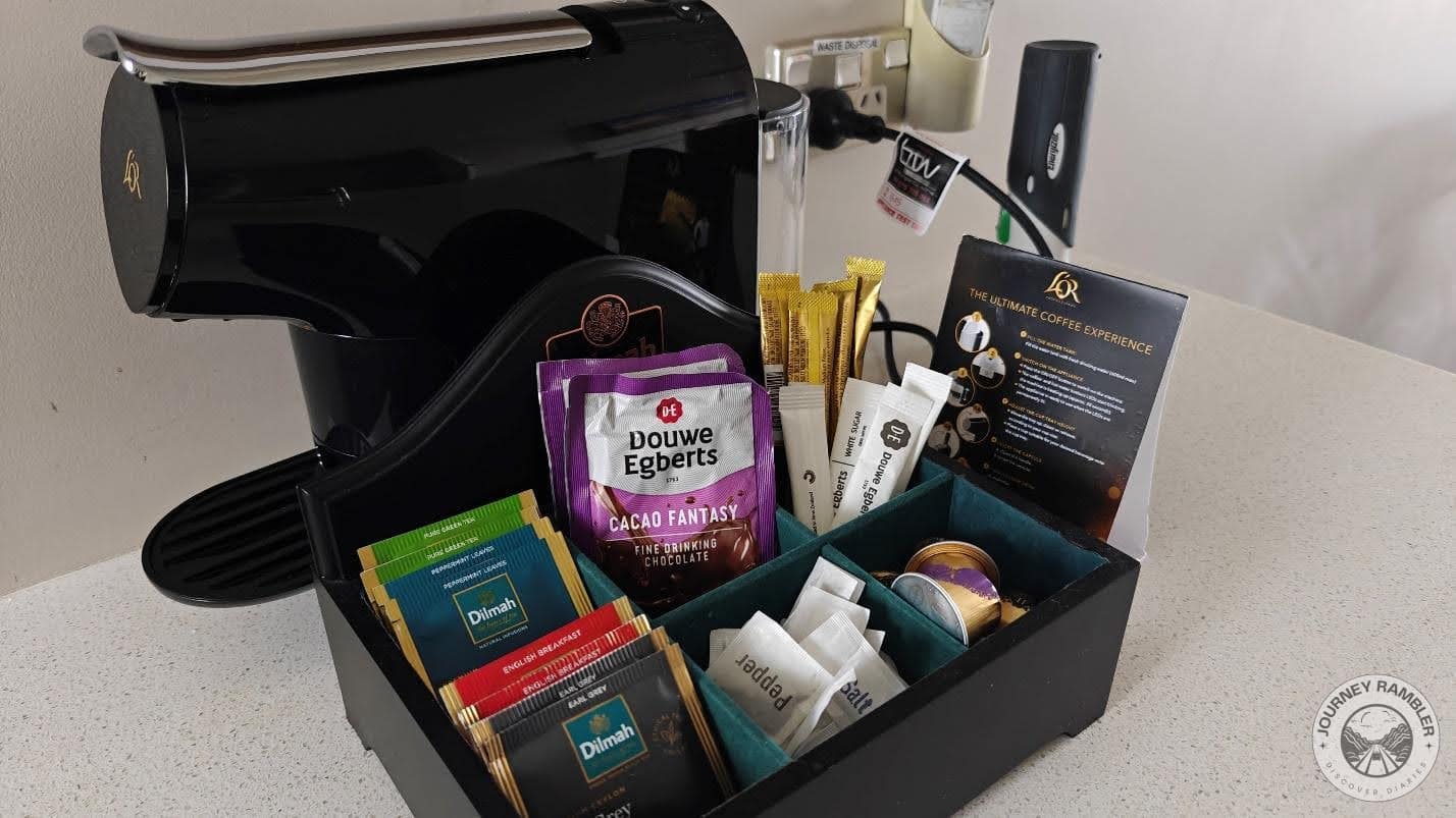 espresso machine, tea, coffee and sugar sachets as well as some cookies