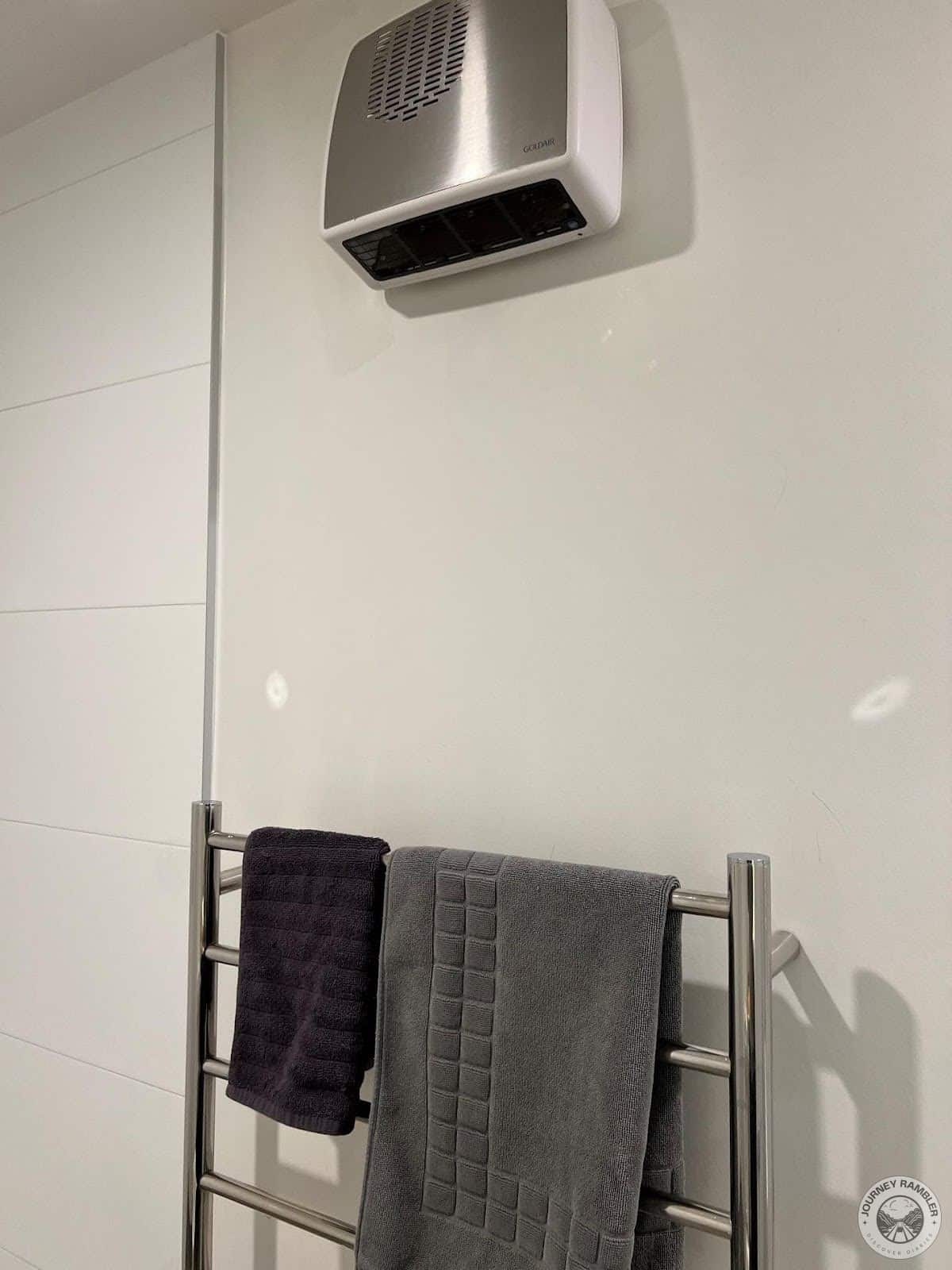 exhaust and a towel rack