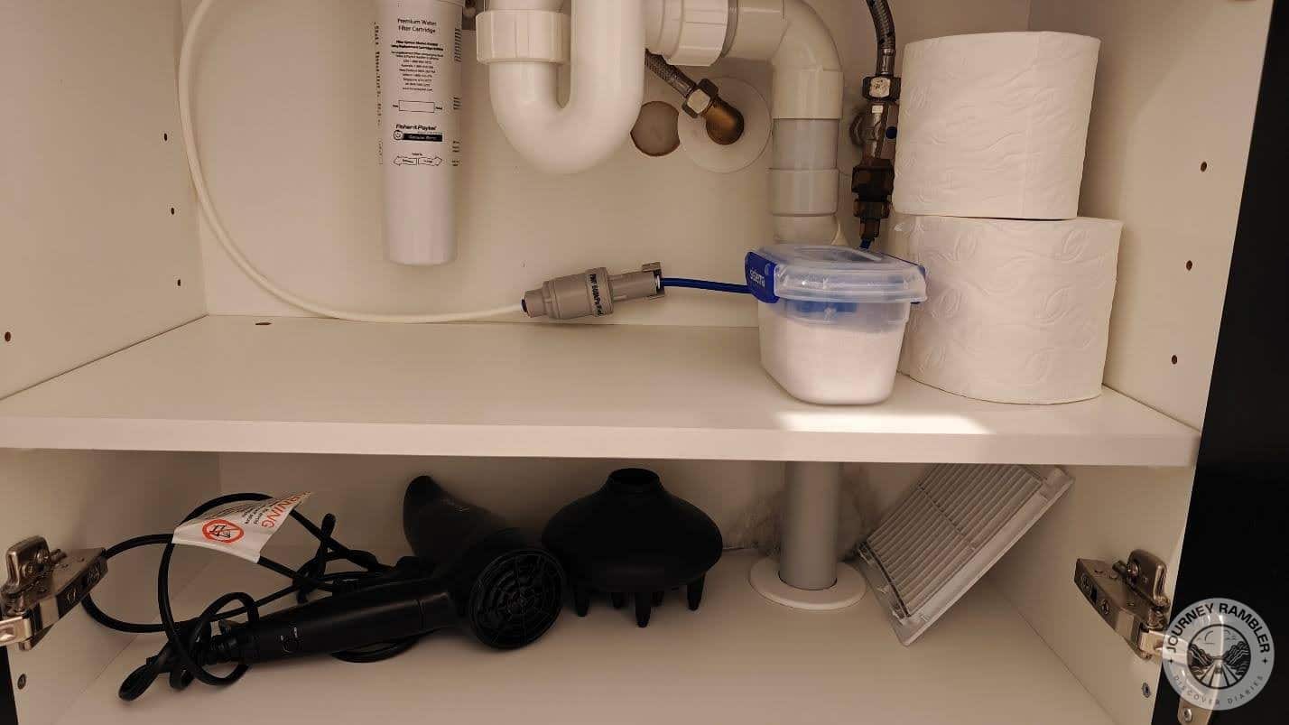 extra rolls of toilet paper and a hairdryer
