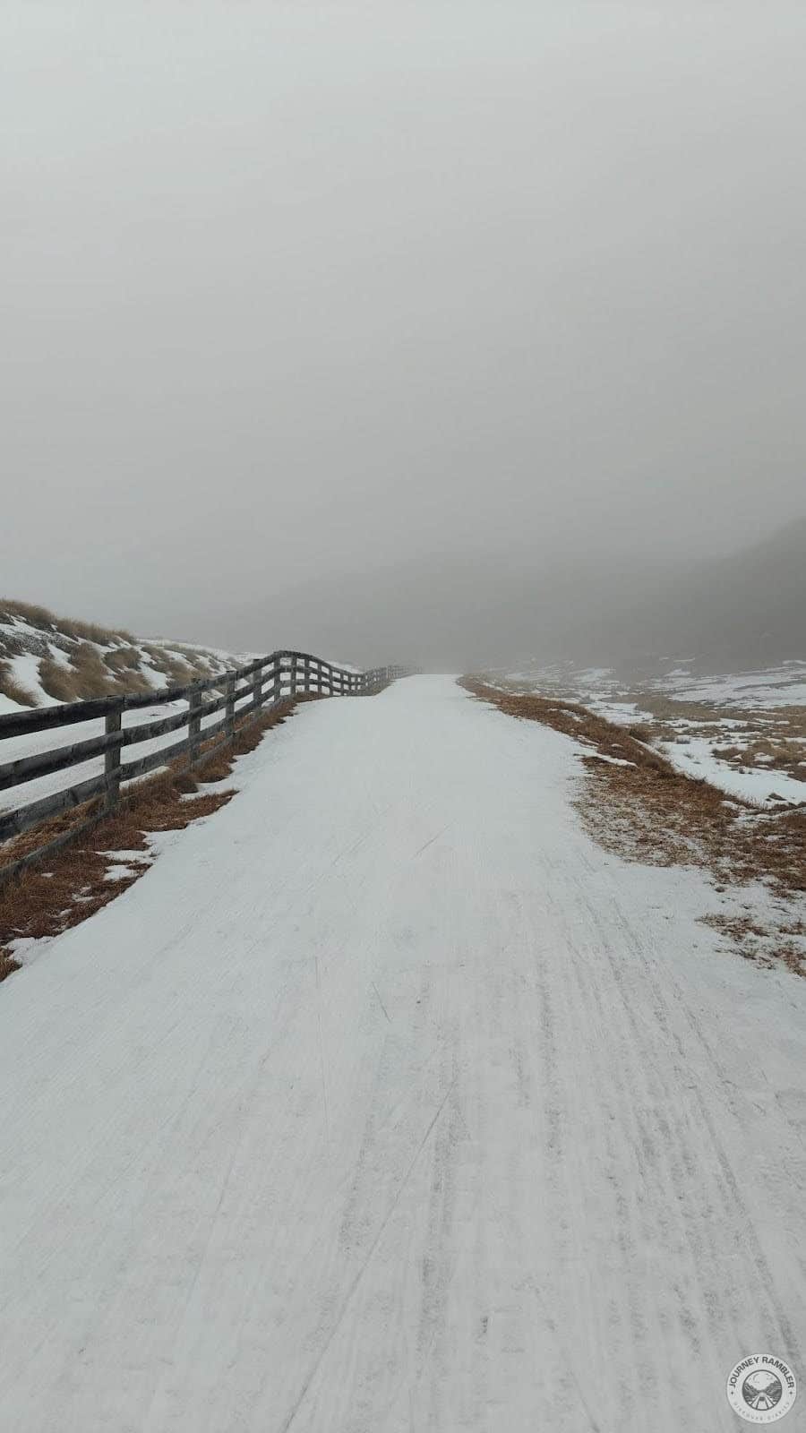 fence on one side of the road