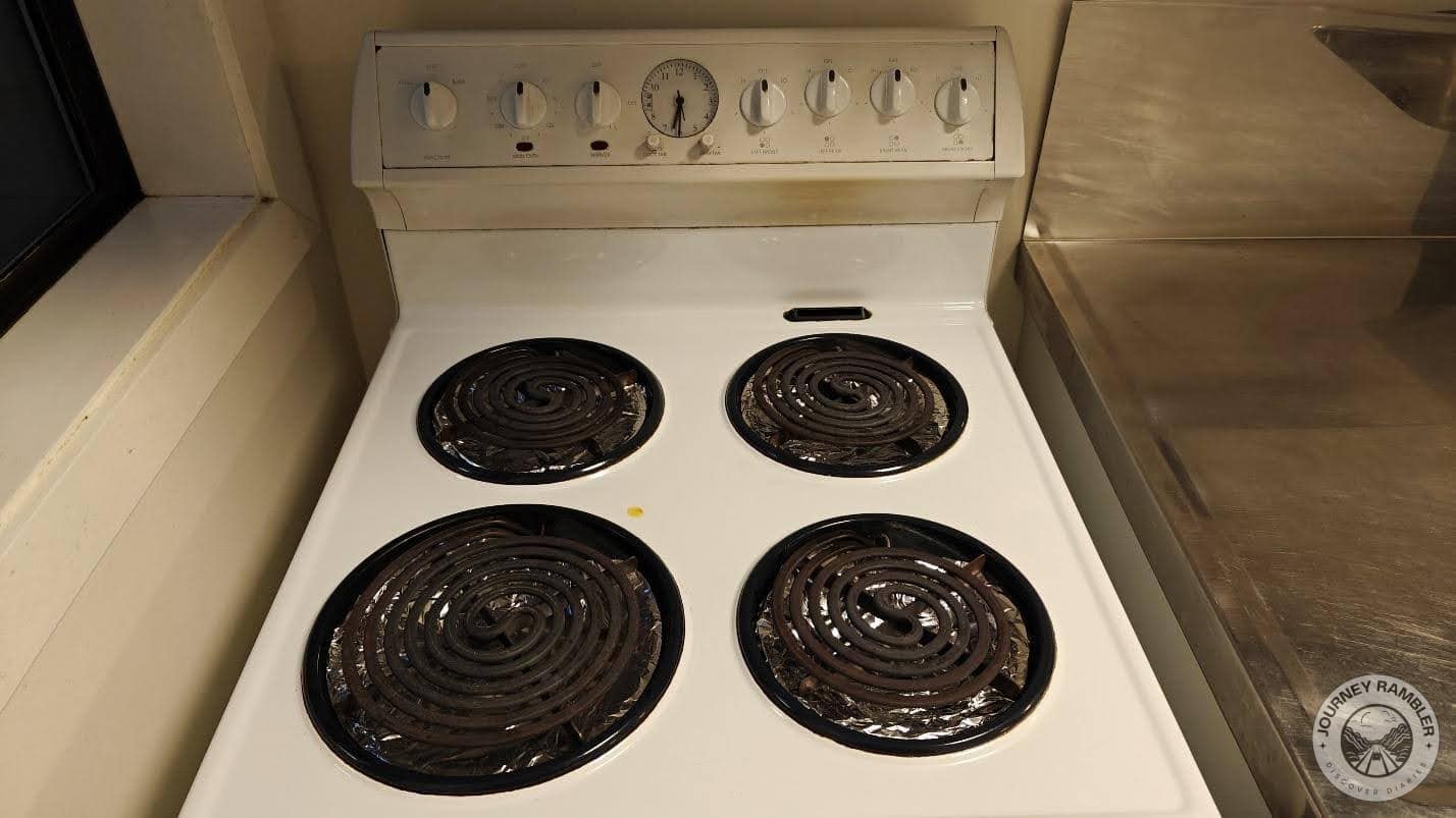 four burners of different sizes on the stove