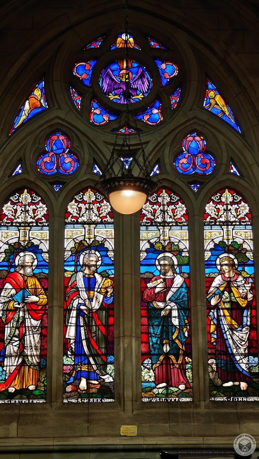 four stained glass paintings of four saints, Saint Mathew, Saint Mark, Saint Luke and Saint John