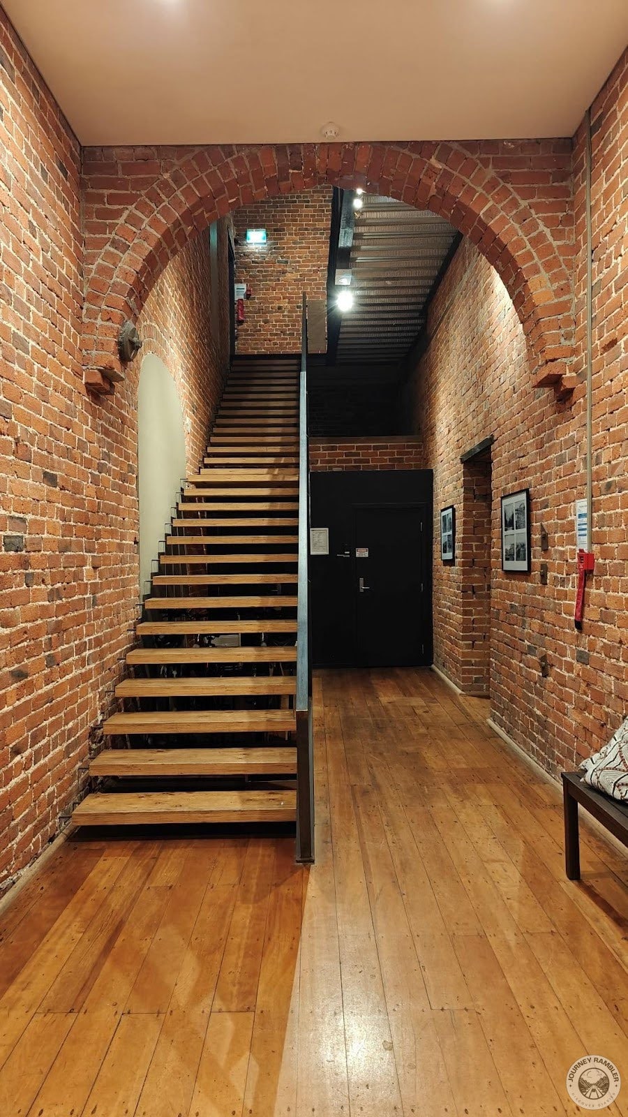 front room had walls of exposed brick and floors of wood