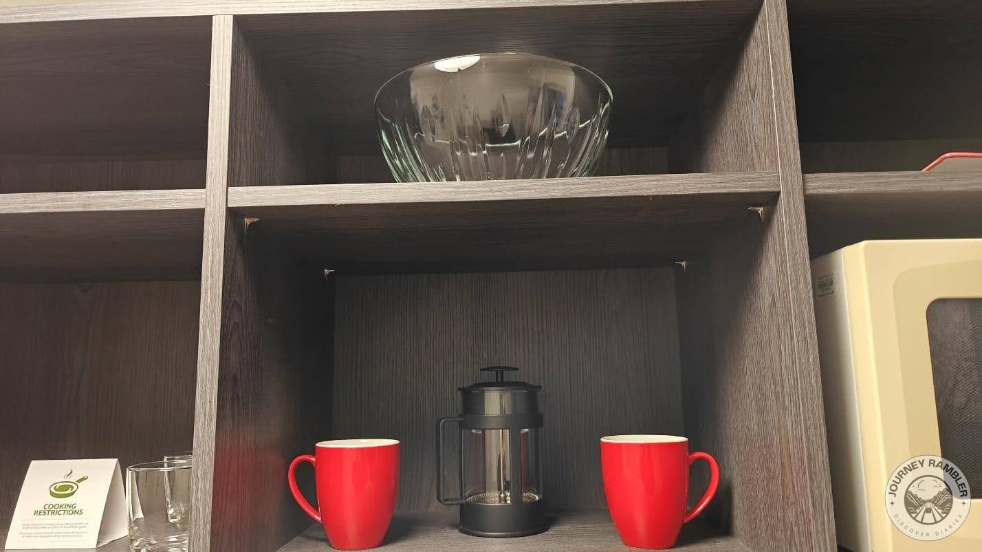 glass bowls, a French press and coffee mugs
