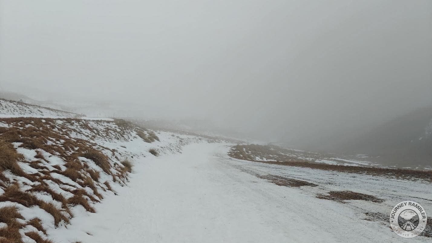 hill gently sloped down from the road