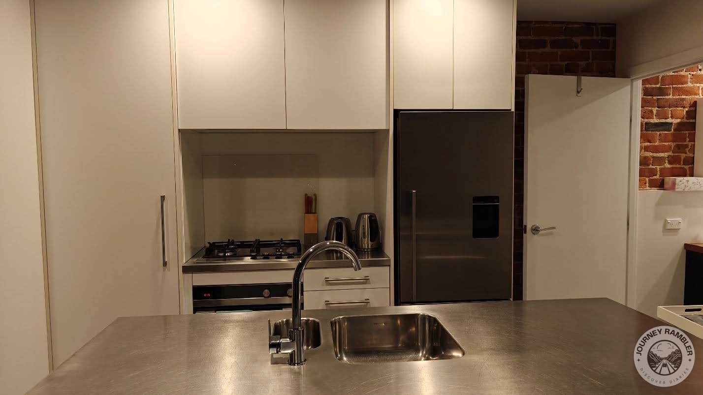 island with a sink and a clean work surface