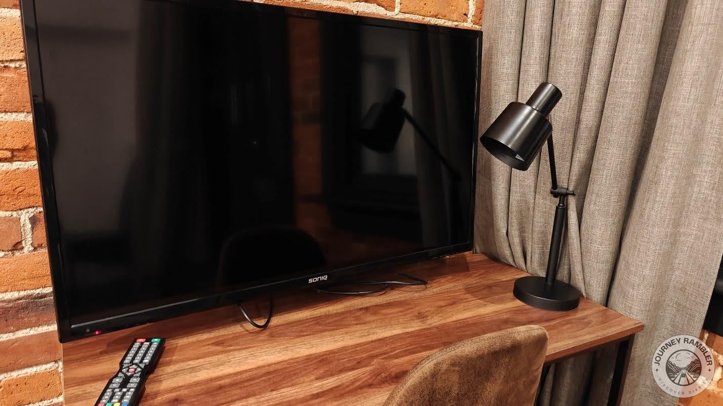 large TV and a reading lamp