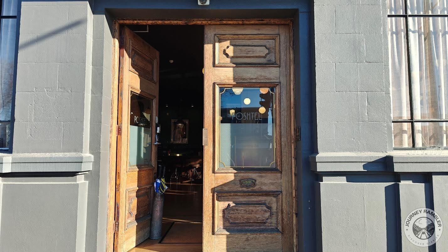 large, double wooden doors at the entrance