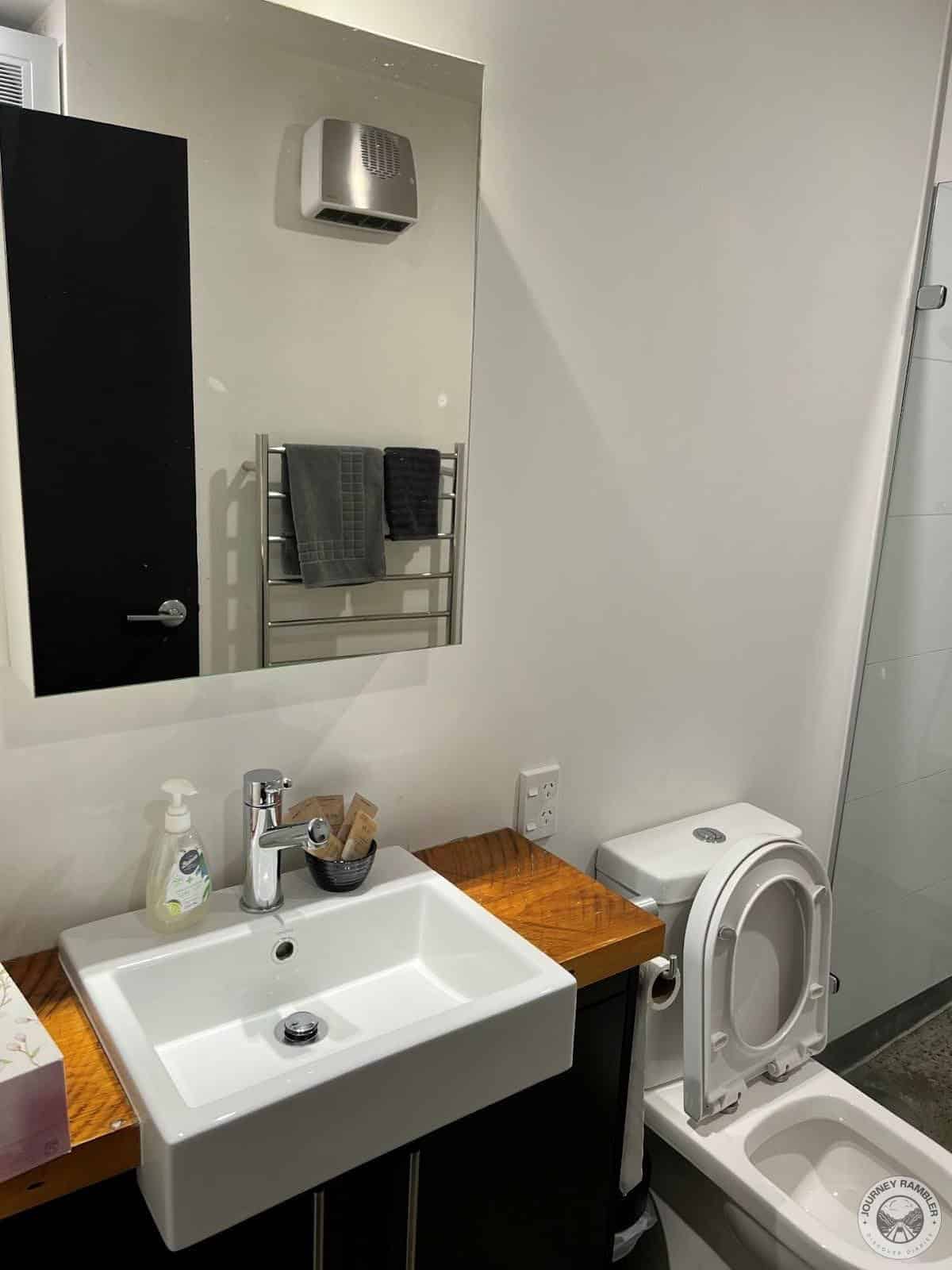 large wall mirror above the washbasin
