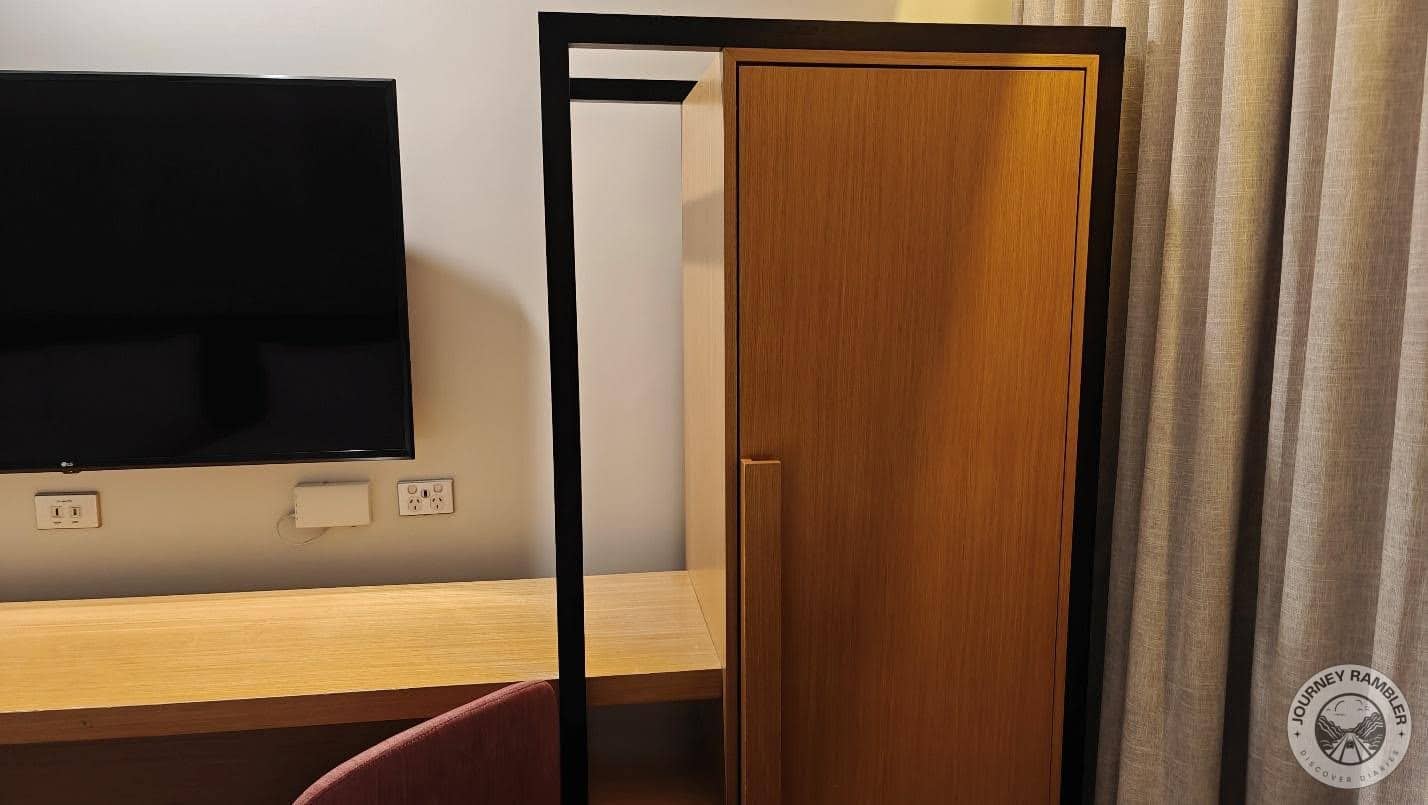narrow cupboard beside the TV