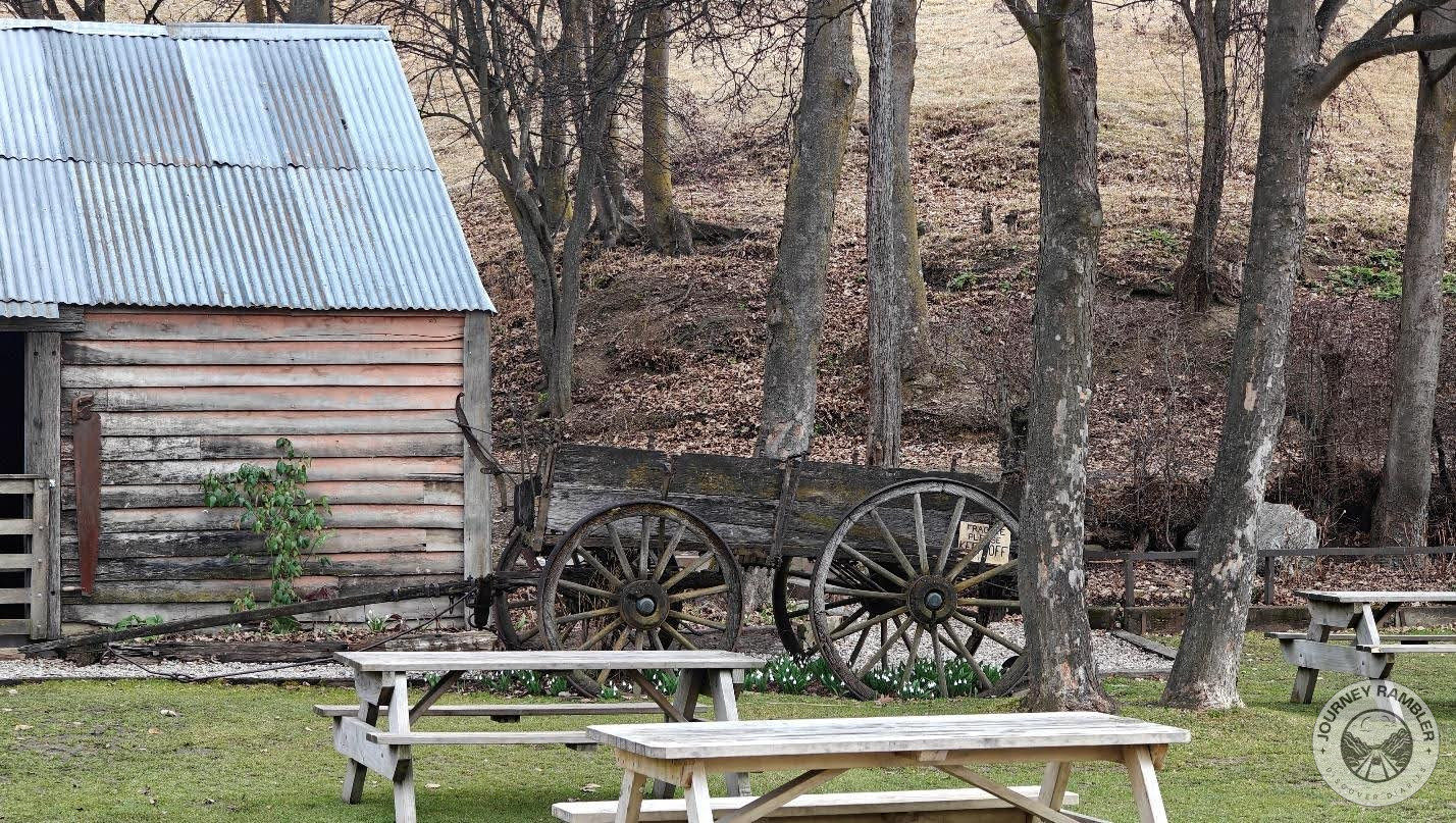 old wooden cart on one side of the lawn