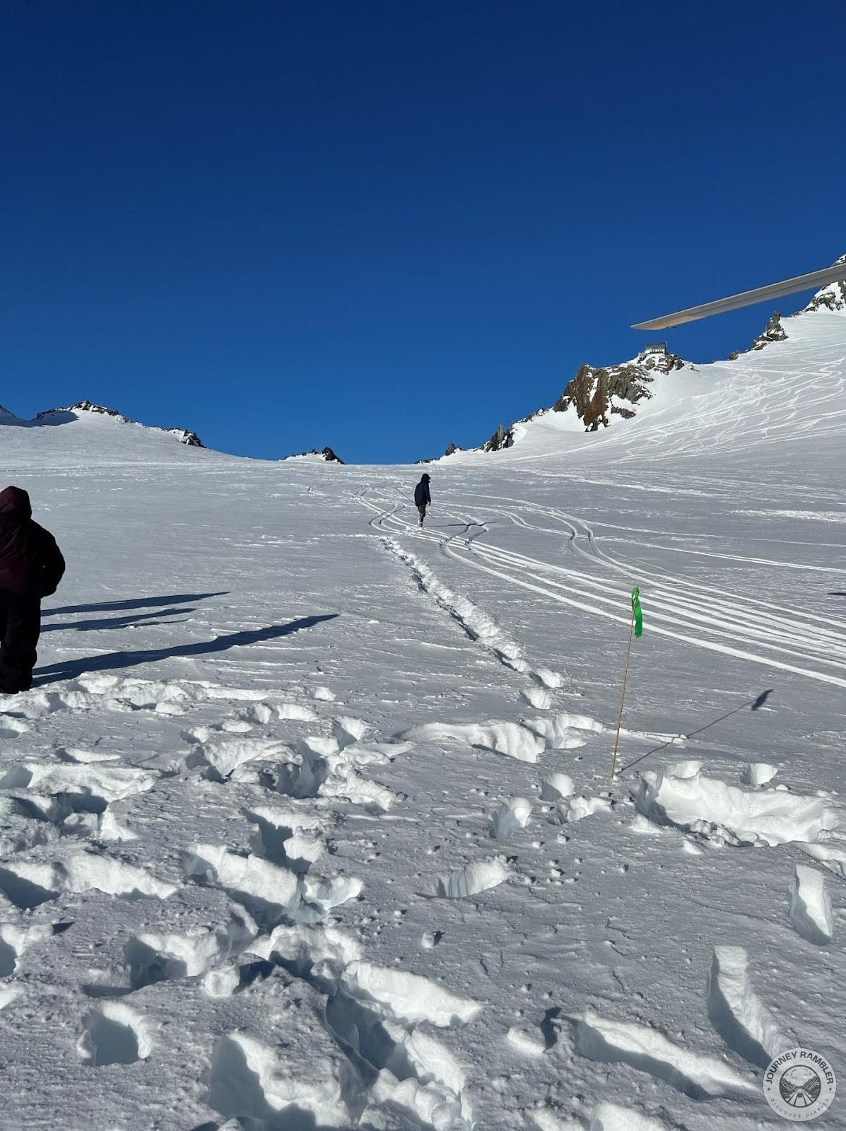 one of the participants in the tour walking pretty far from the rest of their group
