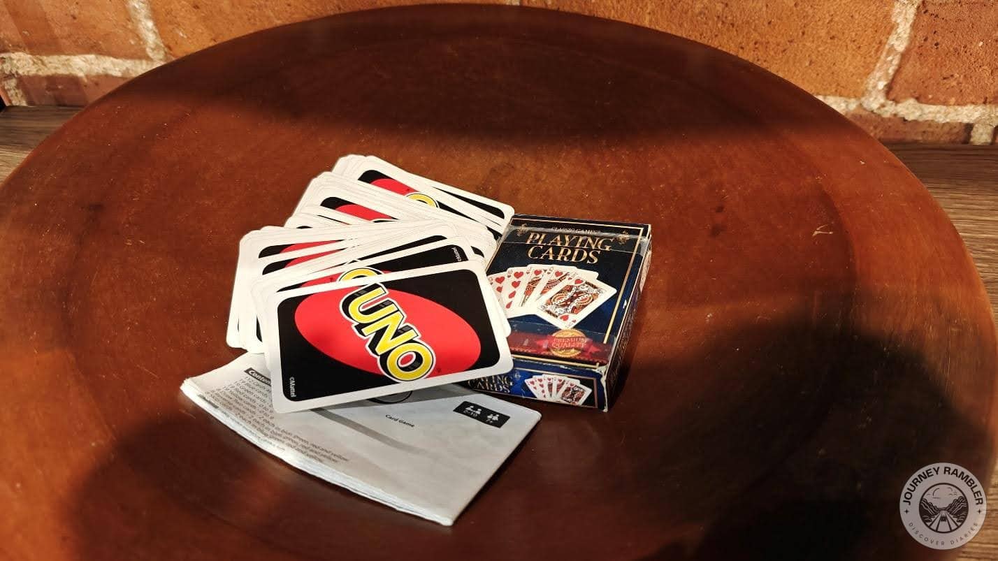pack of playing cards and a pack of Uno cards