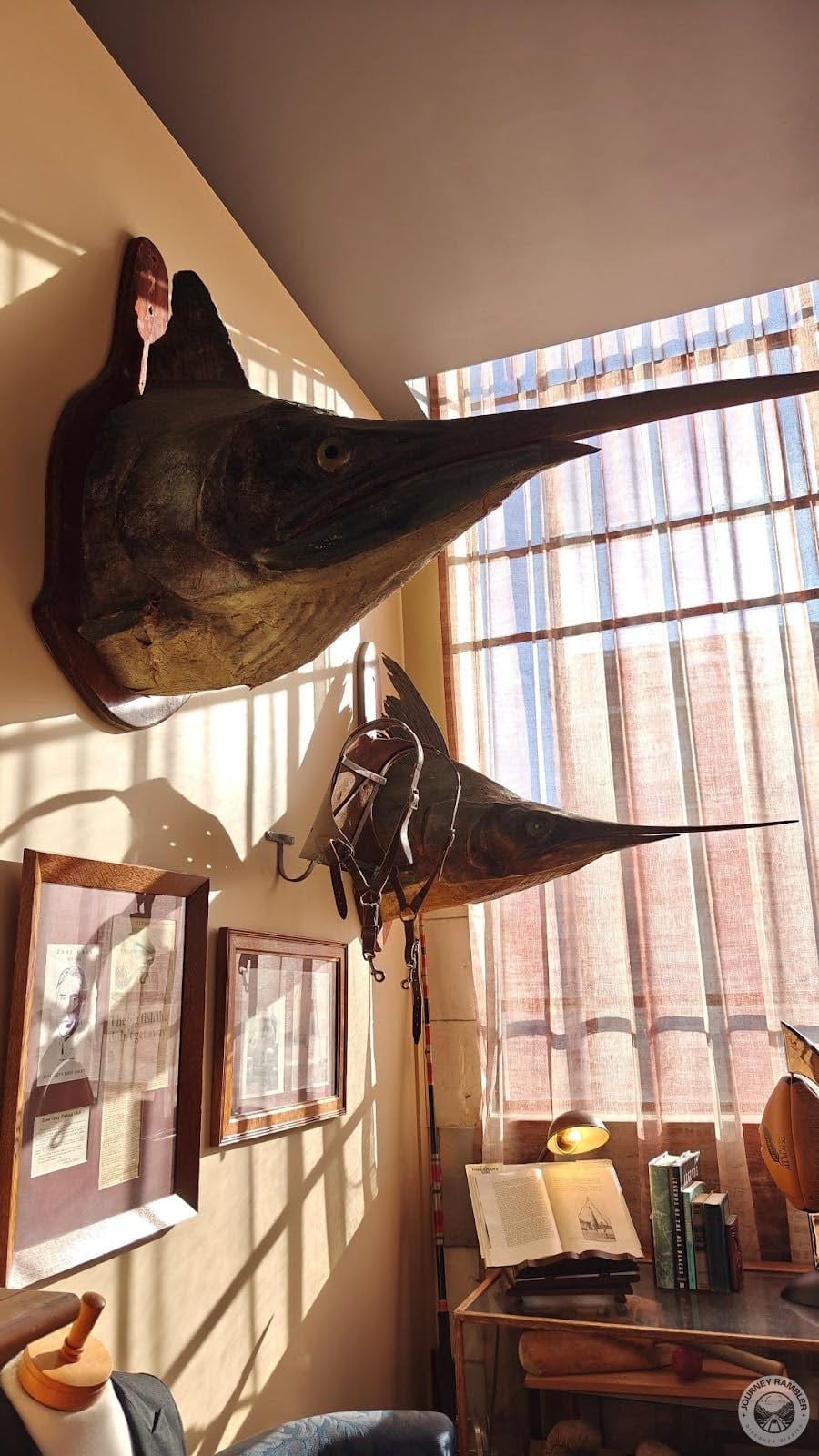 pair of fish heads and a harness was hanging from the walls