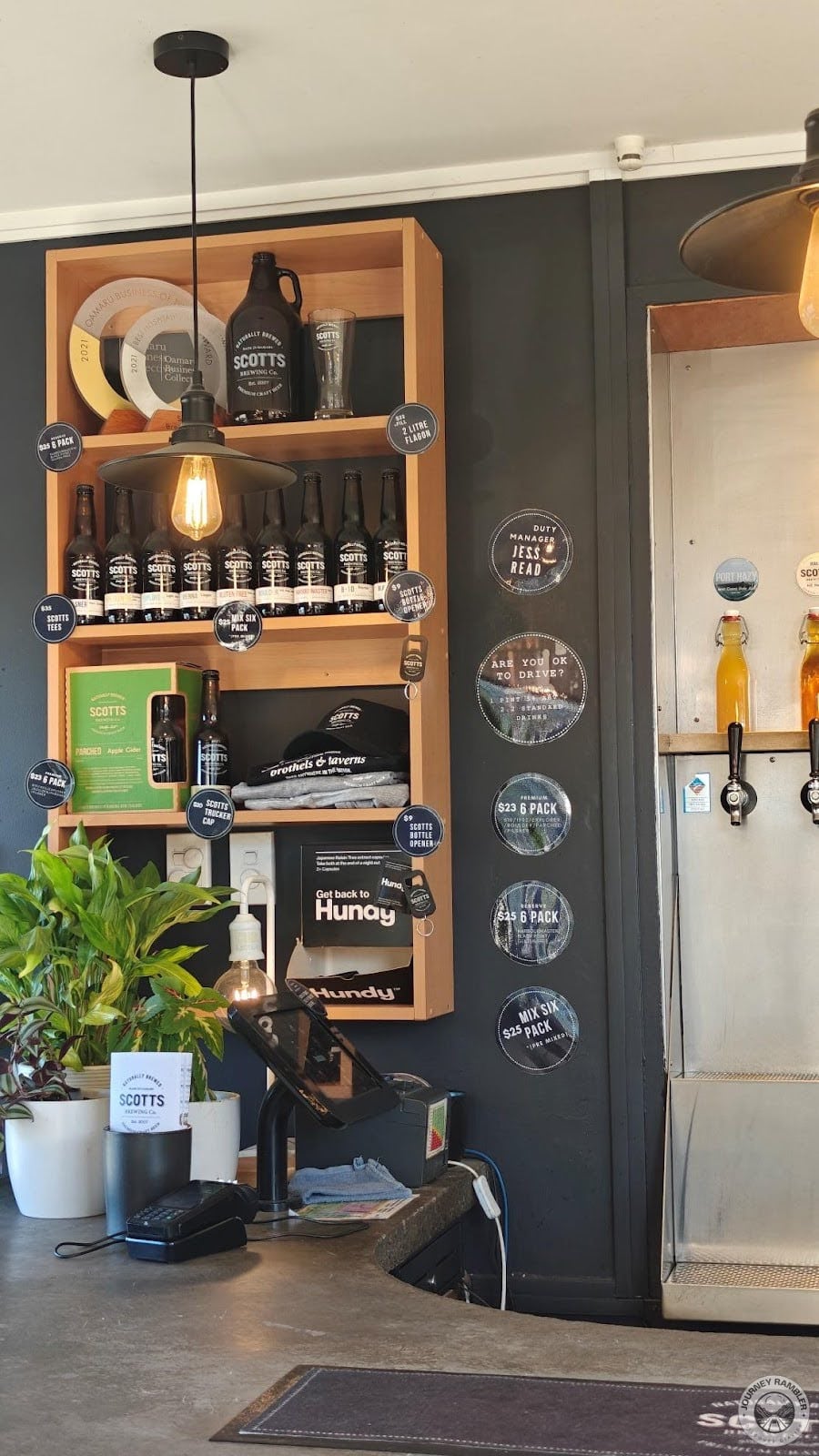 shelves filled with bottles and merchandise about the brewery