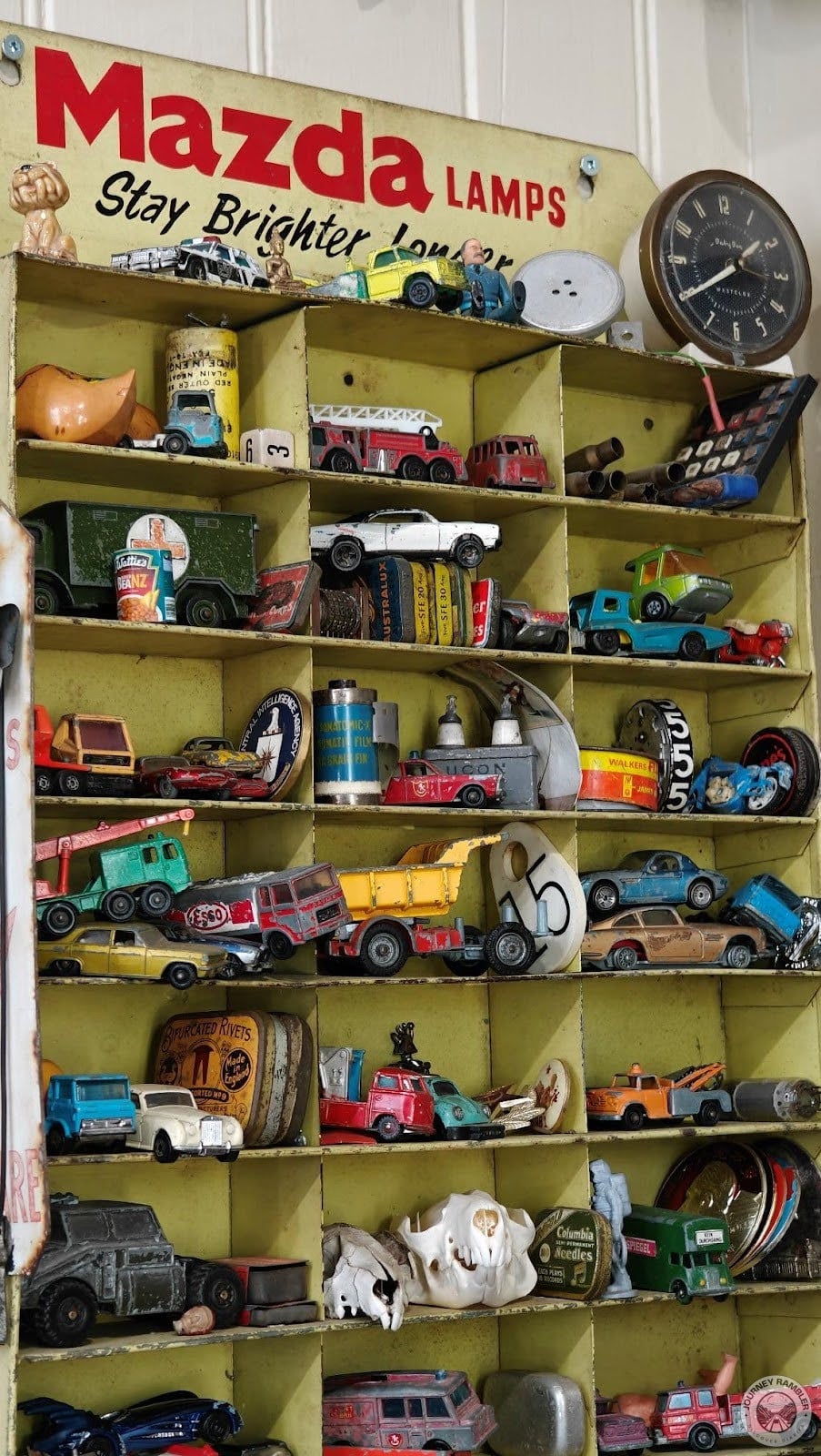 shelves were filled with little toy trucks, buses and cars