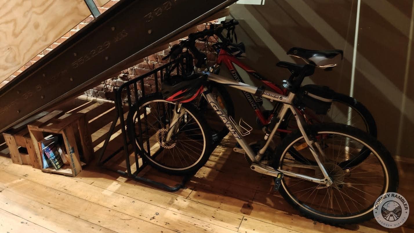 some bicycles under the stairs