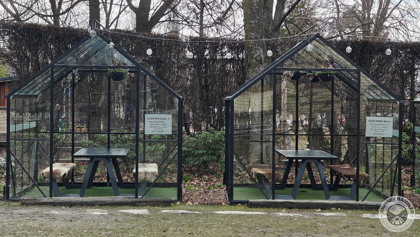 some glass houses in the garden of the Cardrona Hotel