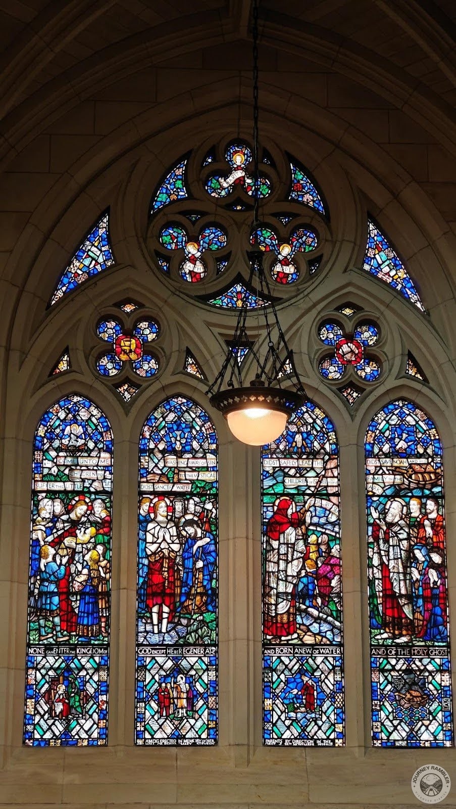 stained glass paintings at the front of the cathedral had a lot of flower designs