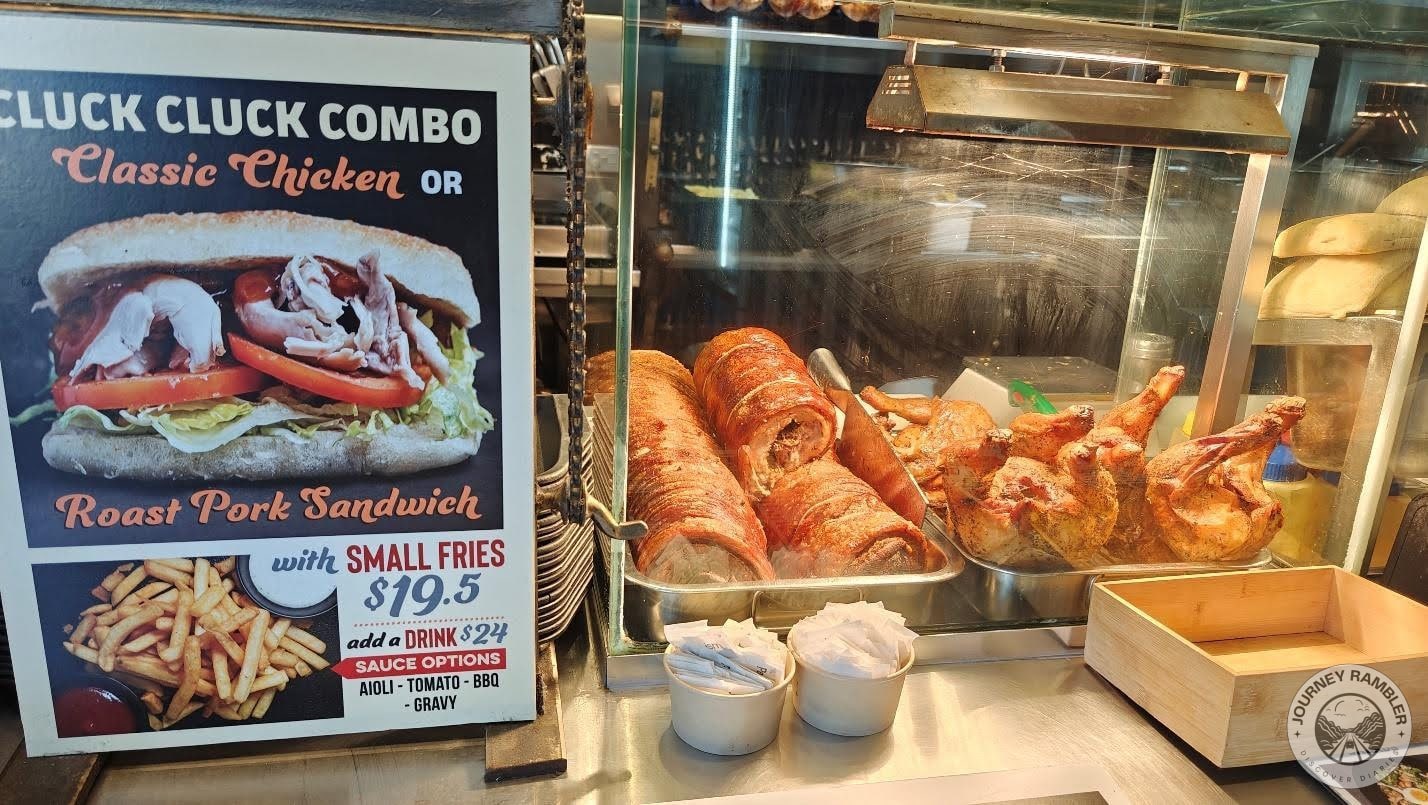 the cooked Rotisserie Chicken and the Roast Pork to be used on their Roast Pork Sandwich