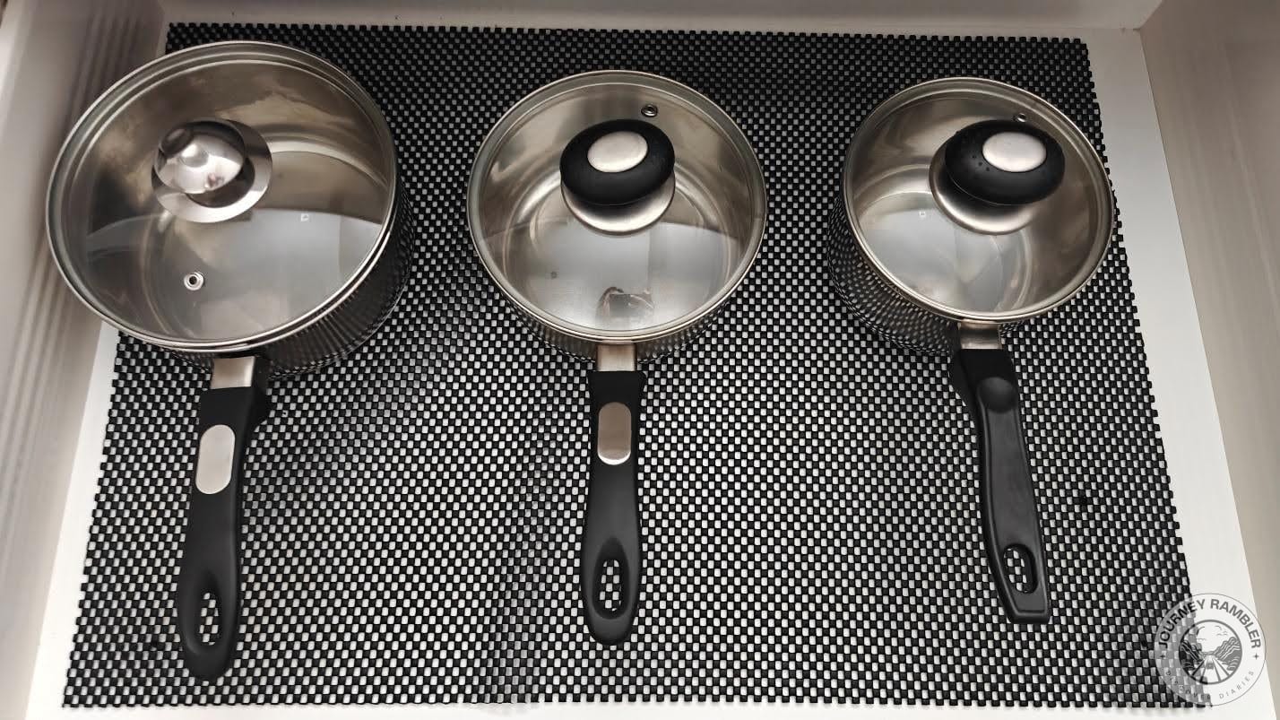 three saucepans in three different sizes