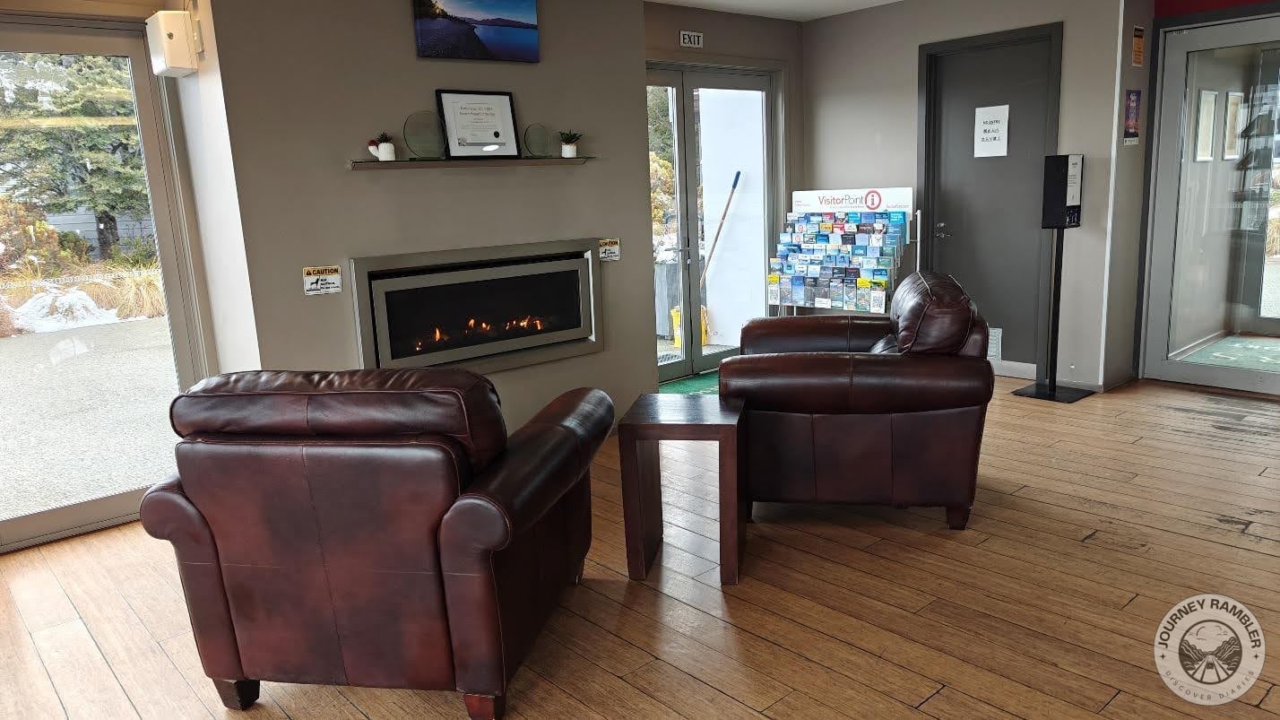 two comfortable leather armchairs before the fire