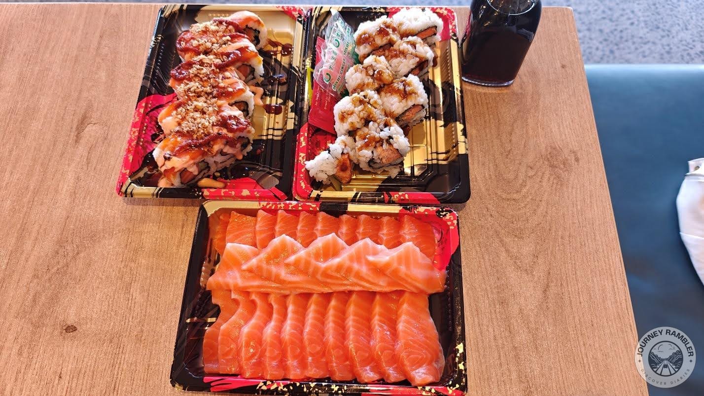 two plates of sushi and some more raw salmon