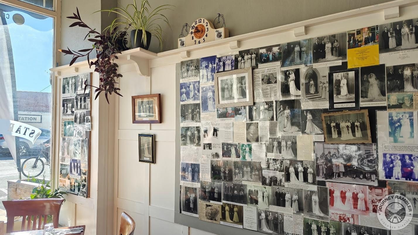 wall full of black and white photographs on one side