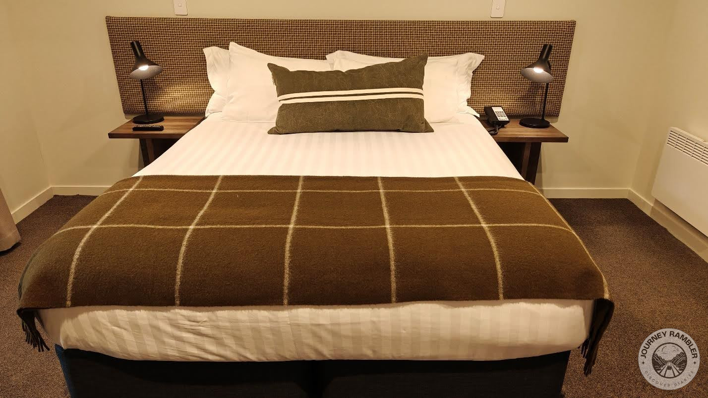 warm blanket had been folded at the foot of the bed