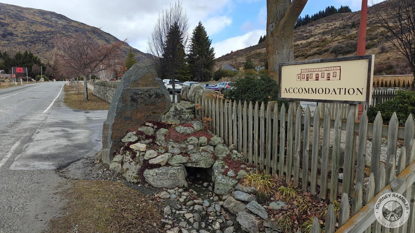 wooden fence separated the garden of the hotel from the main road