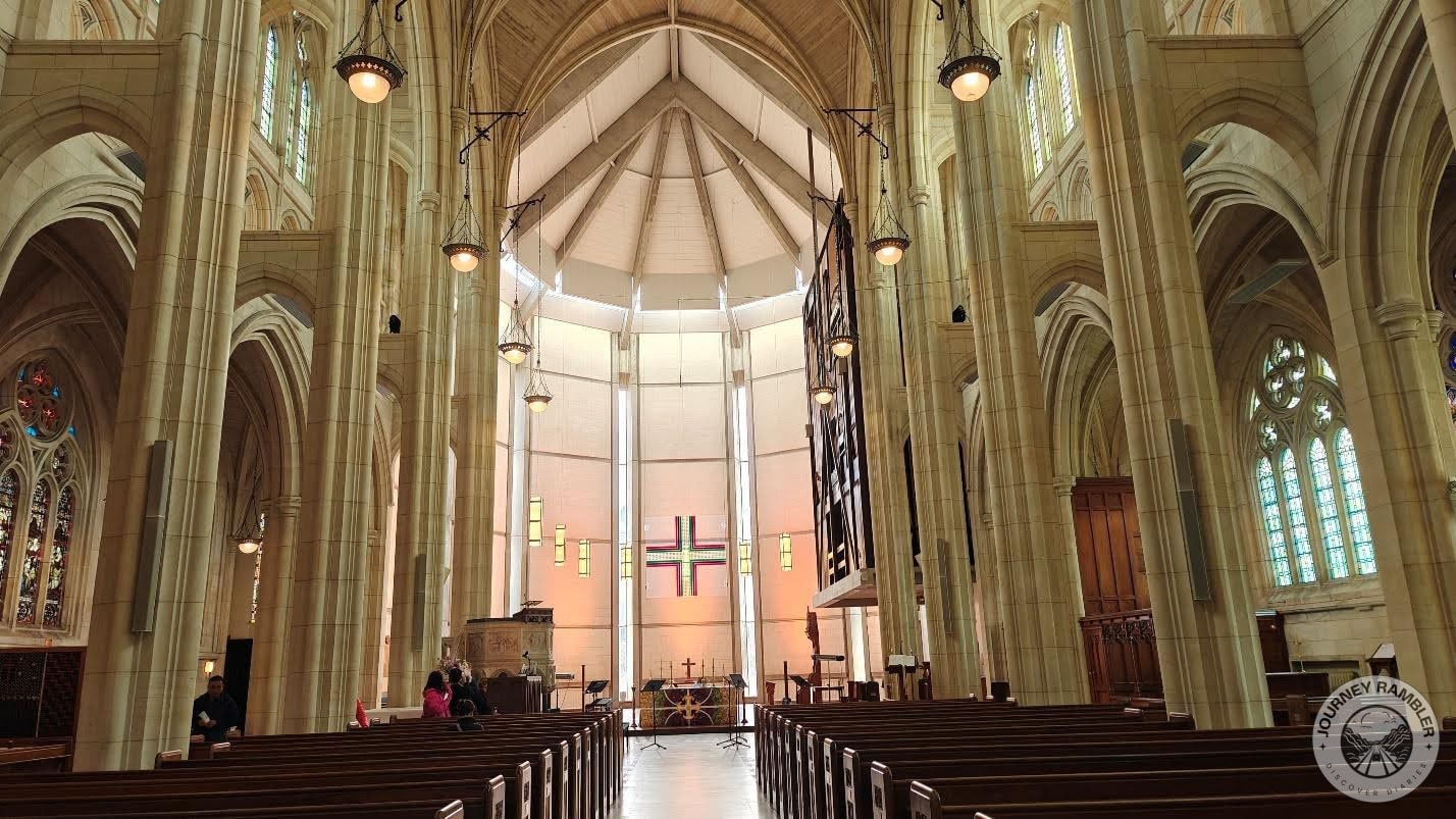 wooden pews on either side of the aisle
