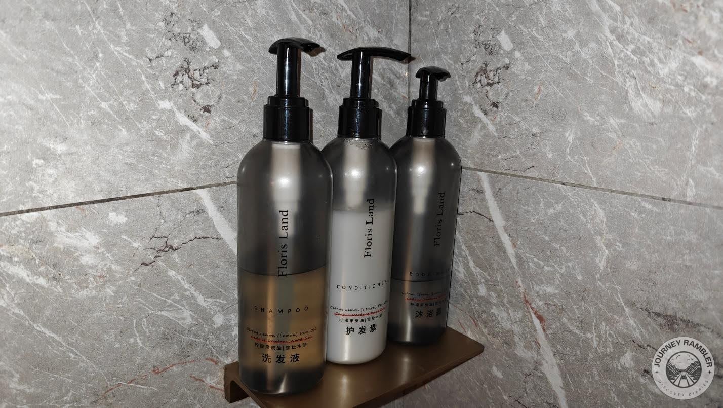 Bottles of conditioner, shampoo and shower gel