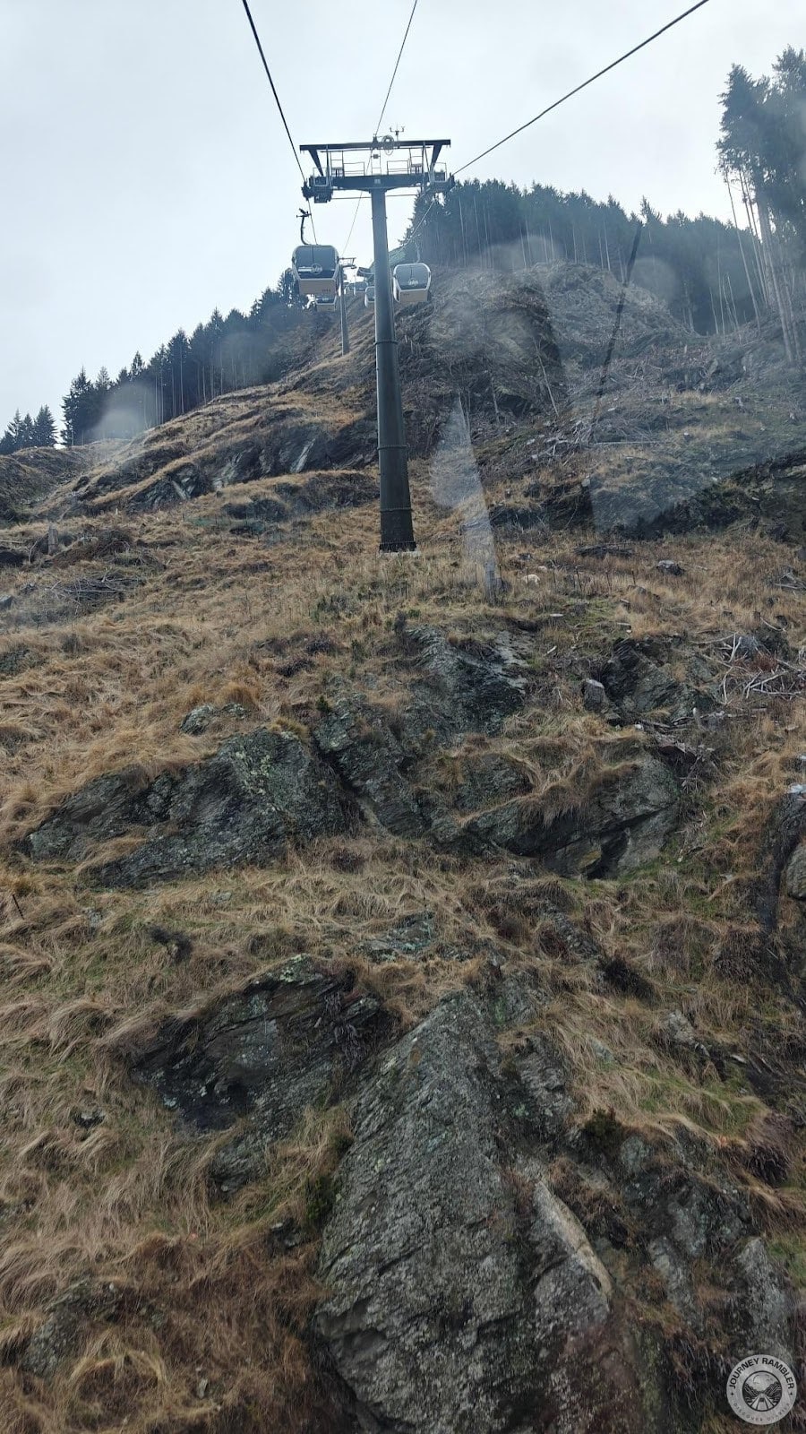 I could only see dry brown grass and rocks under me