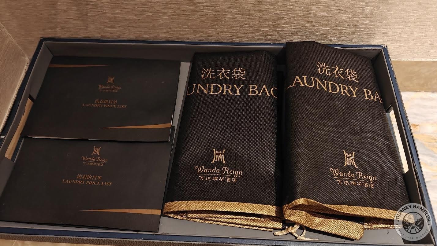 Laundry bags and a price list for all laundry items at the hotel