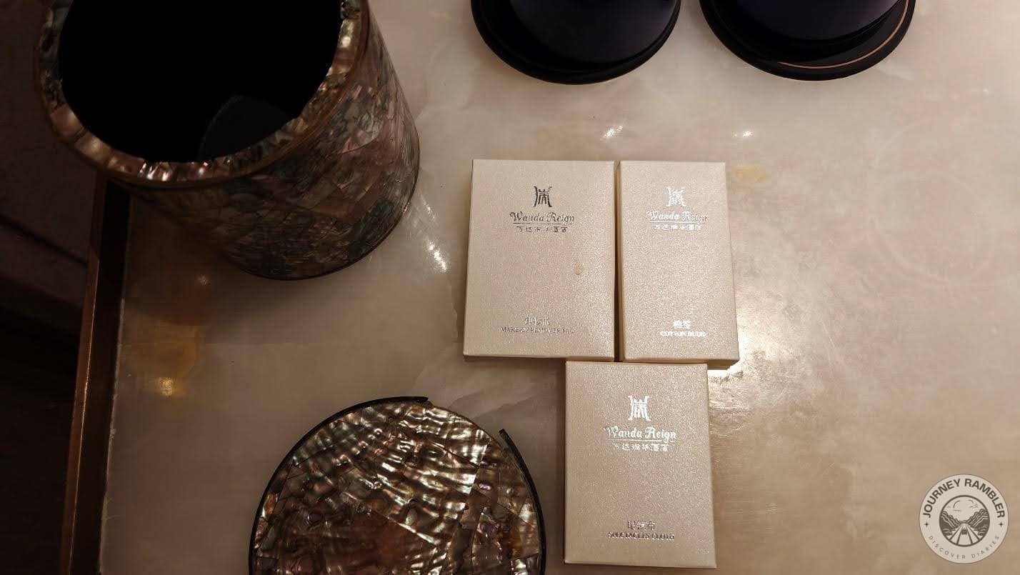 Little boxes of make-up remover, spectacles cloth and cotton balls