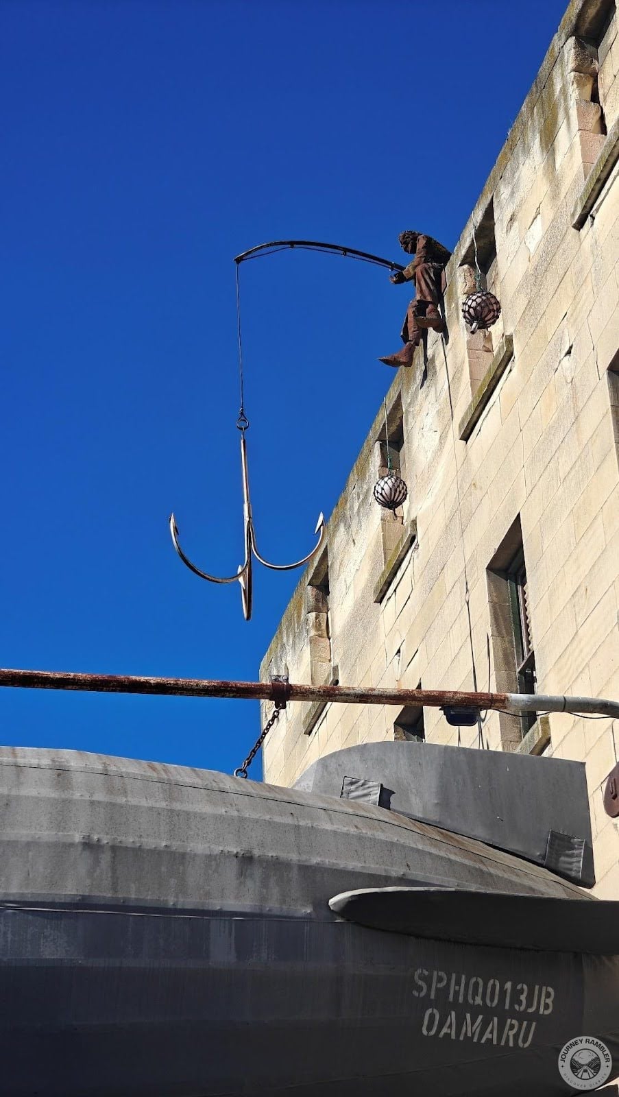 On top of the Steampunk HQ building itself is another figure with a fishing rod