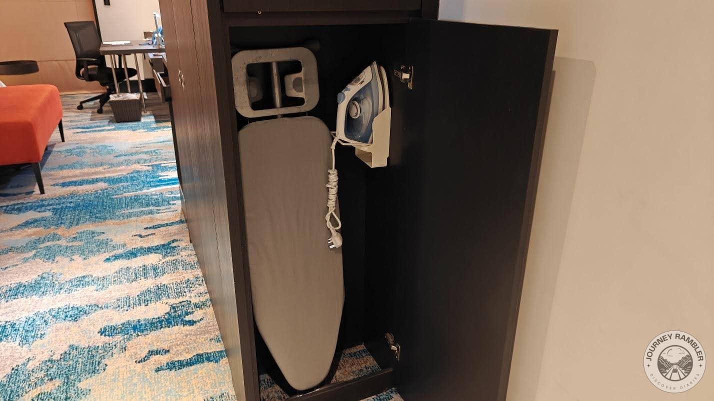 One cabinet held an ironing board and an iron
