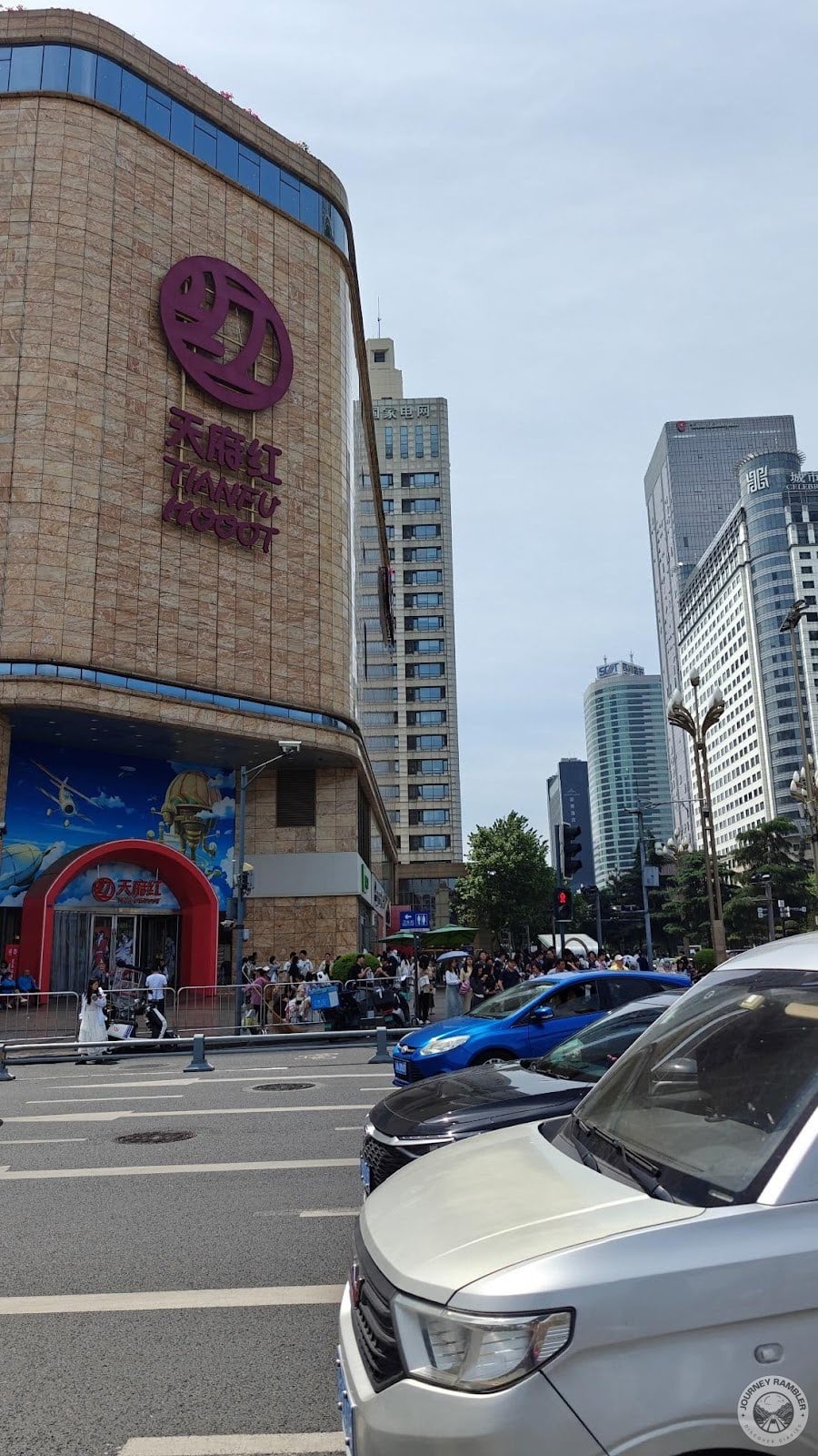 a lot of cars on the roads around Tianfu Square