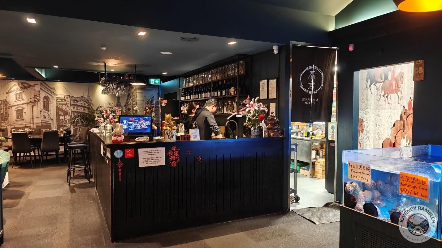 bar and a bartender stood behind the bar