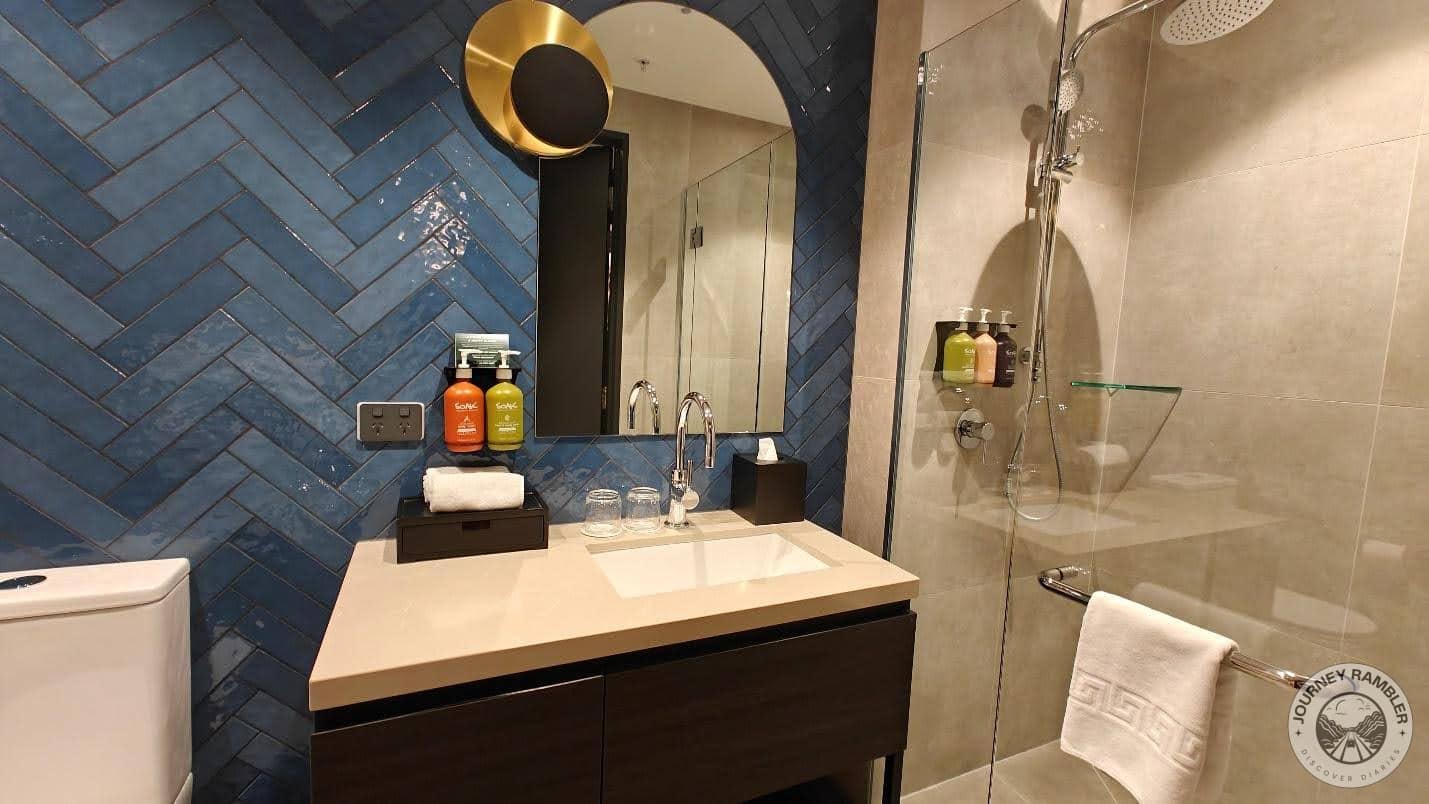 bathroom had beautiful blue tiles and a lovely dressing table and mirror