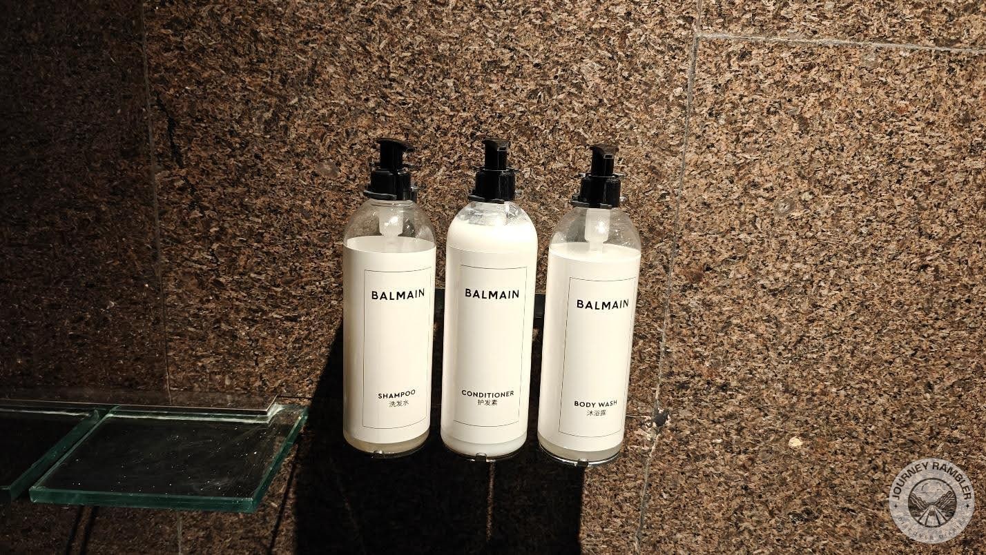 big bottles of shampoo, conditioner and body wash by a brand called Balmain