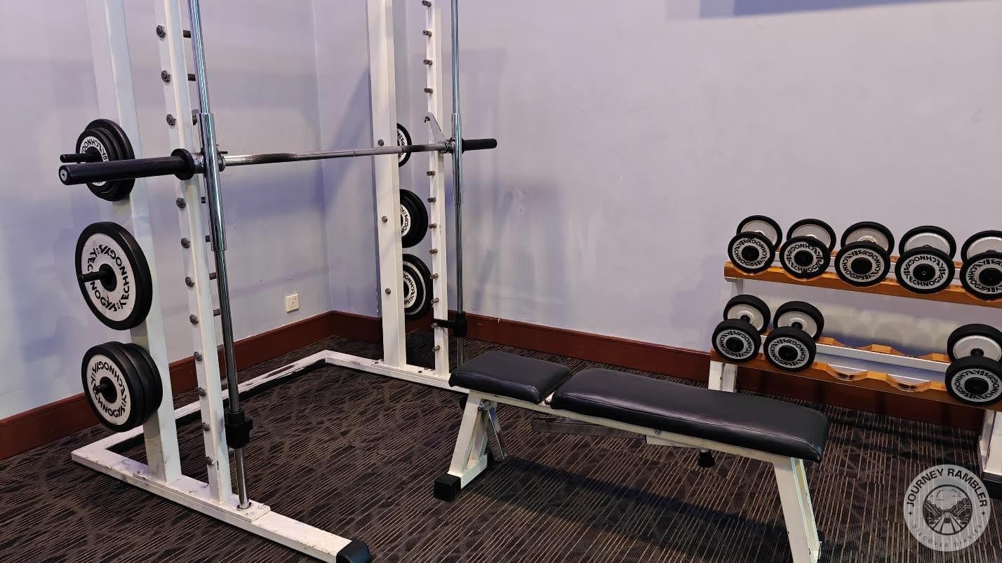 bunch of barbells and dumbbells