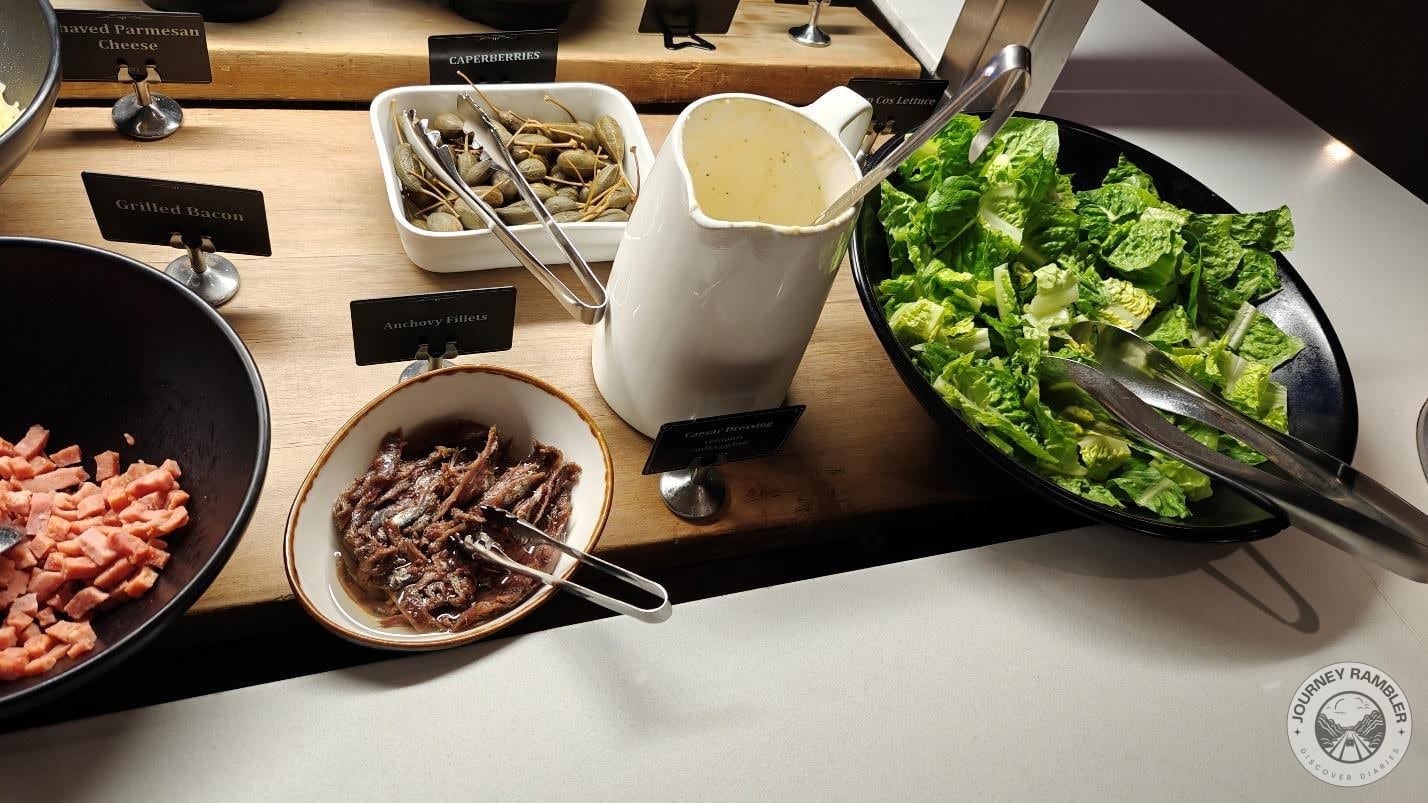 caperberries, anchovies, a special Caesar dressing and lettuce