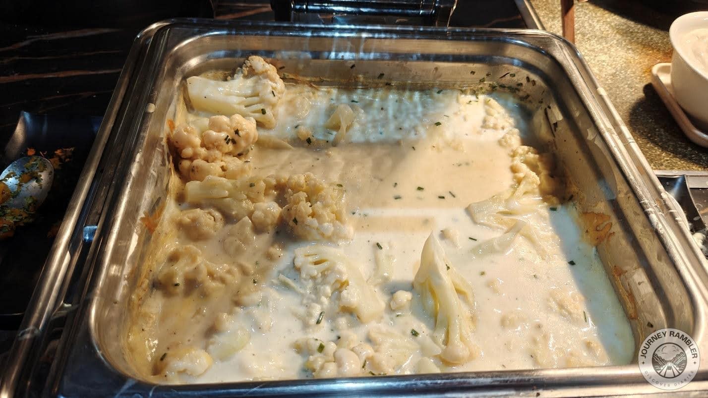 cauliflower in a very creamy and cheesy sauce