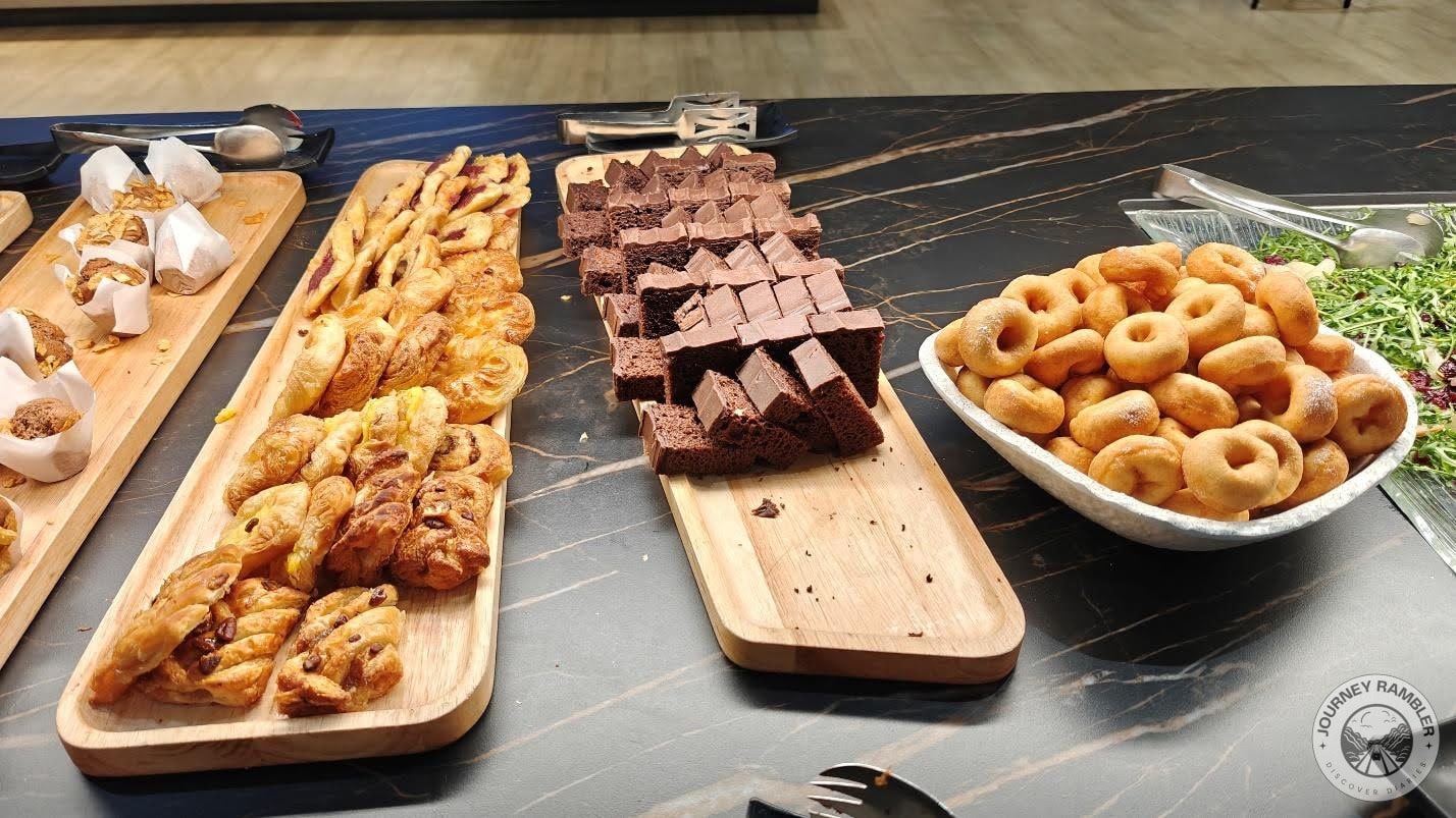 different flavors of Danishes, tea cakes and doughnuts dusted with powdered sugar
