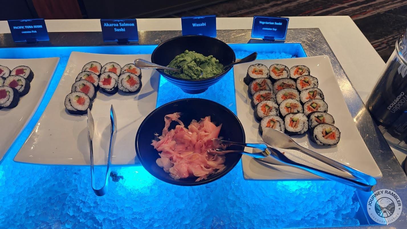 different kinds of sushi, served with wasabi and pickled radishes