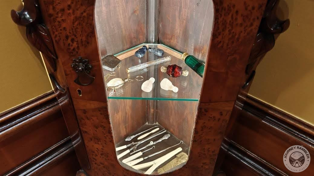 display case with antique items