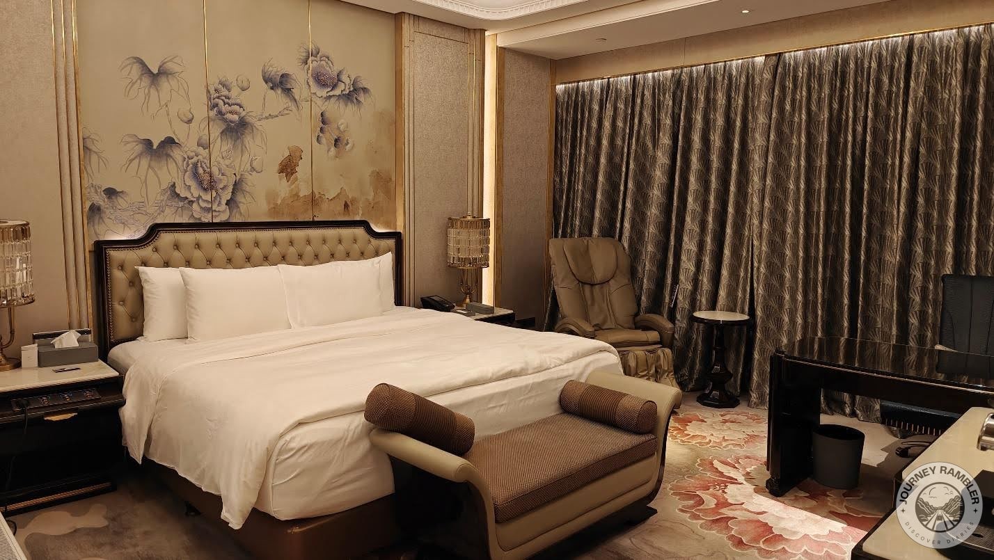 double bed and a couch at the foot of the bed